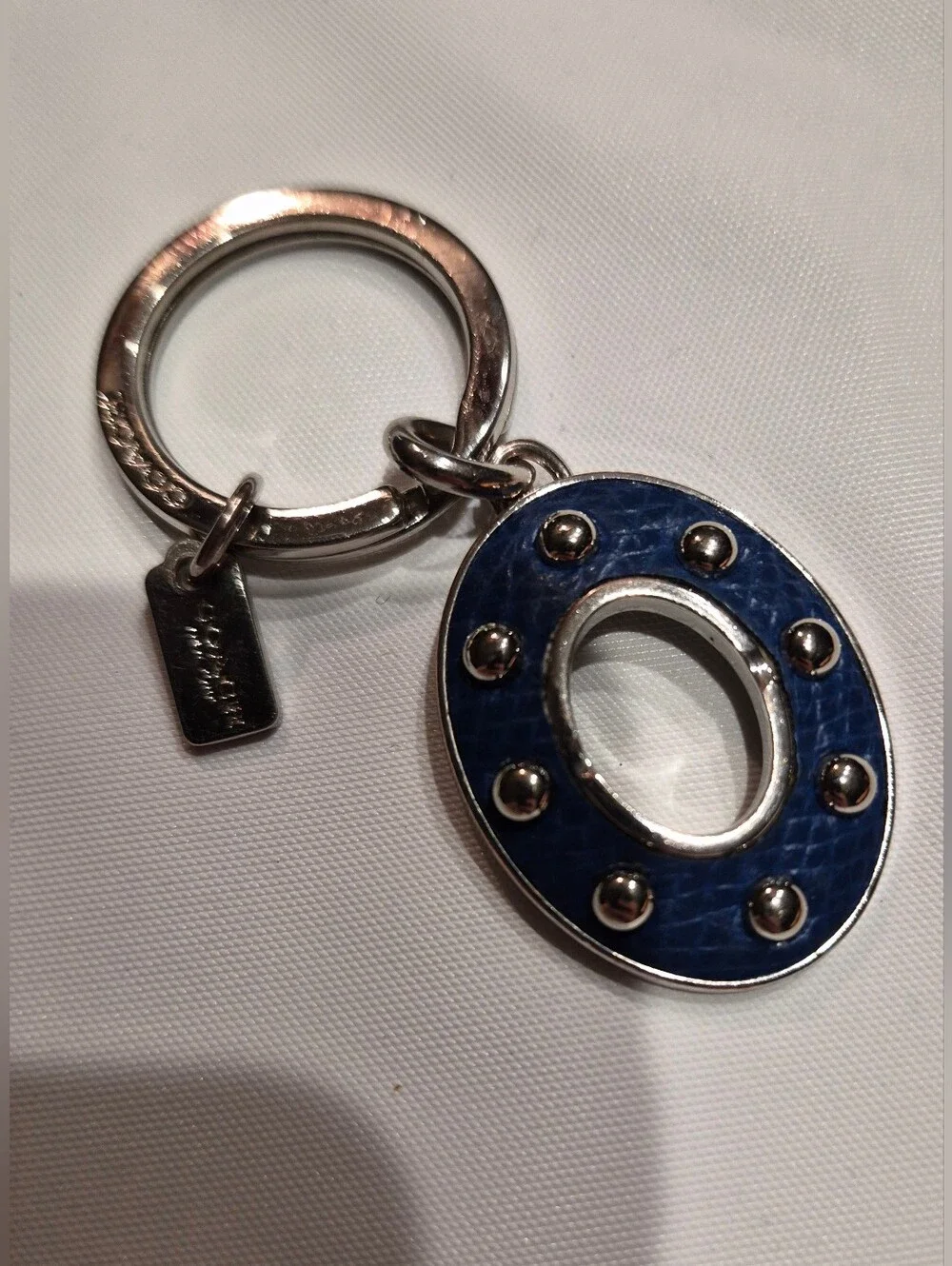 Coach Studded Leather Turnlock Keychain
